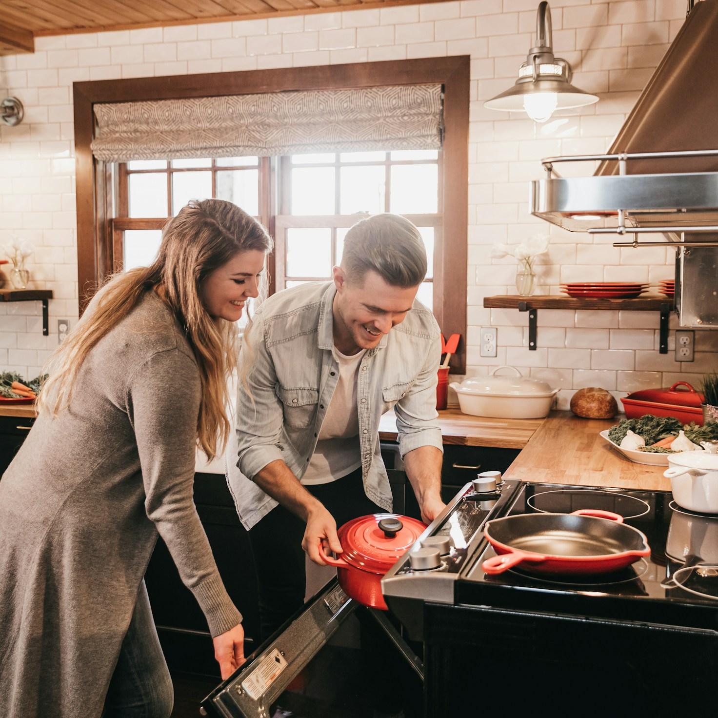 Community members collaborating in a modern kitchen space, sharing recipes and cooking techniques